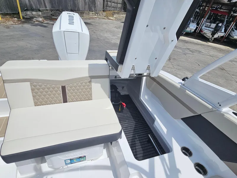 Slide: The Image of 2025 Monterey M-225 boat interior with beige seating and modern design. - 11