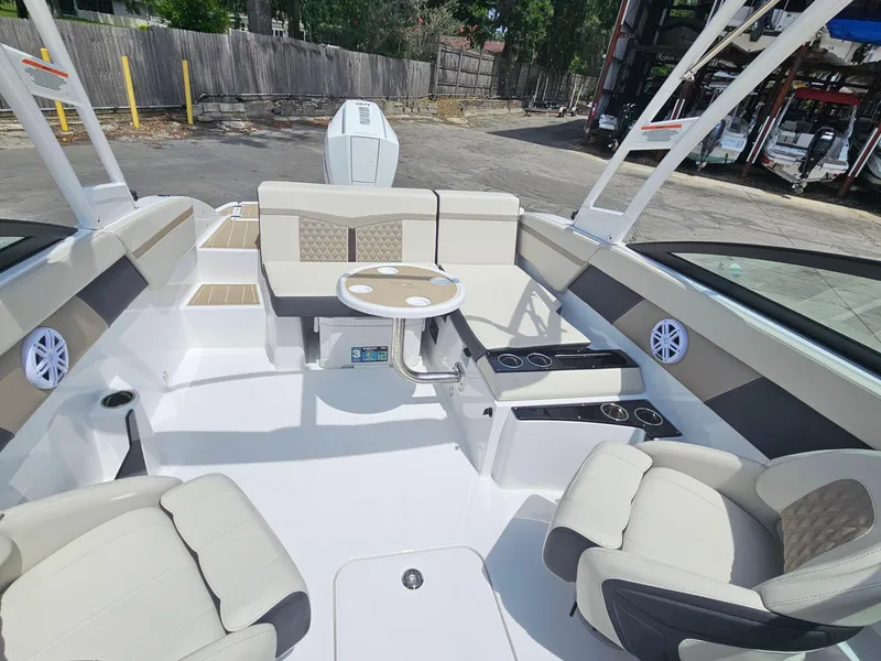 Slide: The Image of 2025 Monterey M-225 boat interior with beige seating and modern design. - 8