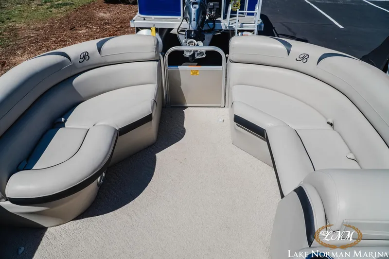 Slide: The Image of 2013 Berkshire 190CL pontoon boat interior with plush seating at Lake Norman Marina. - 11