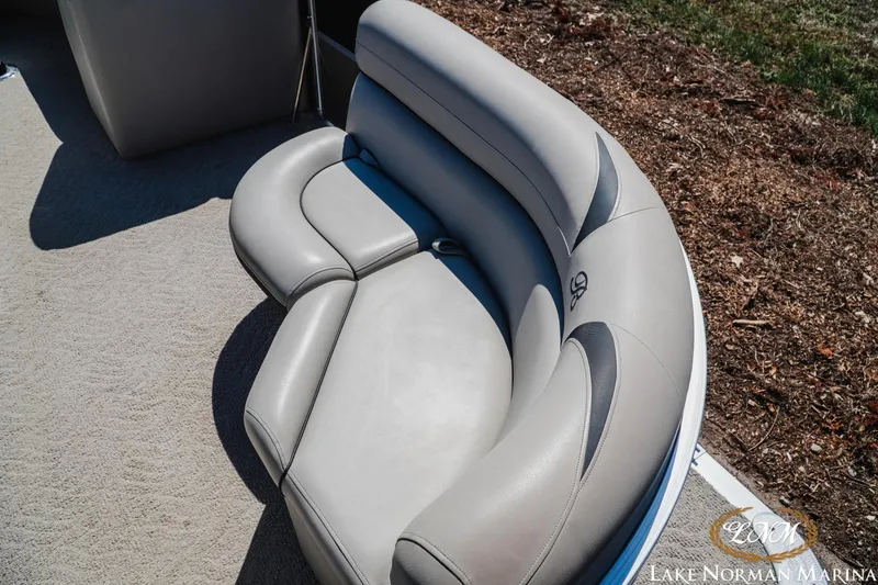 Slide: The Image of Luxurious seating on a 2013 Berkshire 190CL boat, featuring plush gray upholstery. - 15