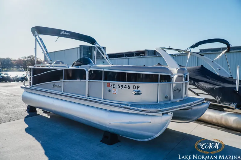 Slide: The Image of 2013 Berkshire 190CL pontoon boat at Lake Norman Marina, silver and black design. - 4