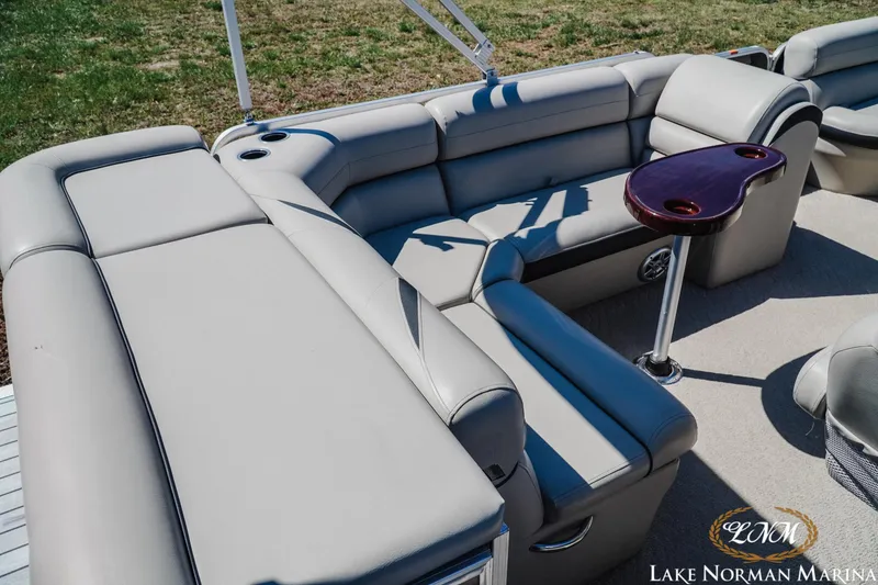 Slide: The Image of Luxurious seating area on a 2013 Berkshire 190CL pontoon boat with cupholders and table. - 6