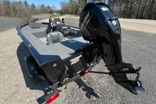 Slide: The Image of 2025 Tracker Super Guide V-16 SC boat with Mercury 50 engine on gravel. - 3