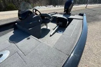 Slide: The Image of 2025 Tracker Super Guide V-16 SC boat interior with steering console and seating. - 9