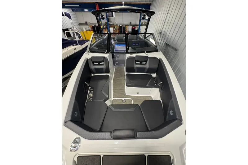 Slide: The Image of 2021 Scarab 285 ID boat interior with sleek black seating and modern design. - 10