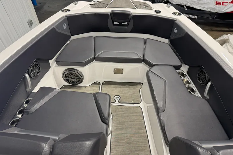 Slide: The Image of Interior of 2021 Scarab 285 ID boat with cushioned seating and speakers. - 11