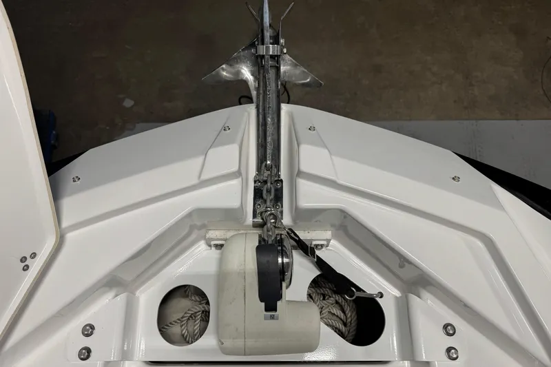 Slide: The Image of Bow view of 2021 Scarab 285 ID boat with anchor and storage compartment. - 12
