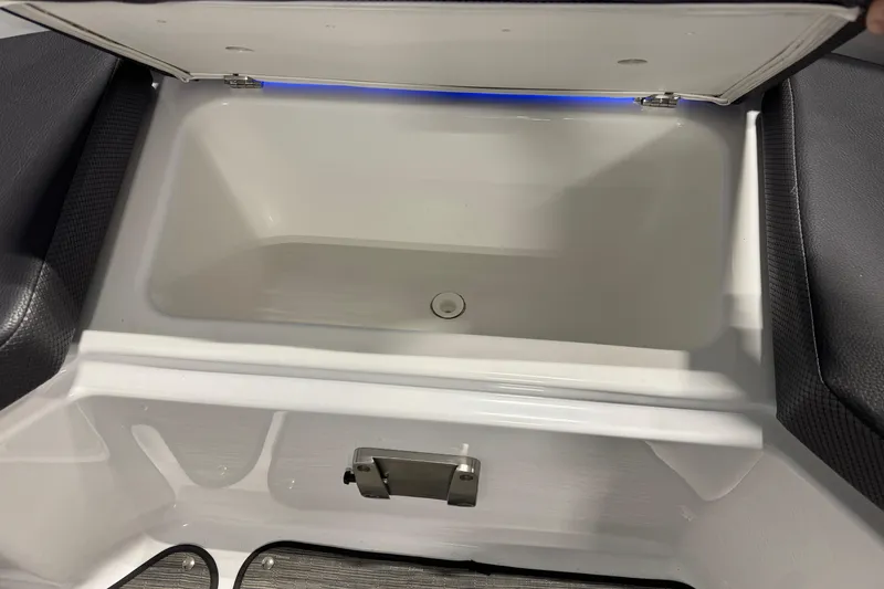 Slide: The Image of Open storage compartment in 2021 Scarab 285 ID boat, featuring sleek interior design. - 19