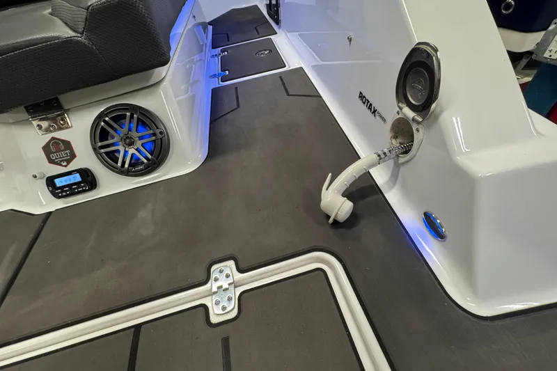 Slide: The Image of 2021 Scarab 285 ID boat interior with speaker, Rotax engine, and modern design features. - 21