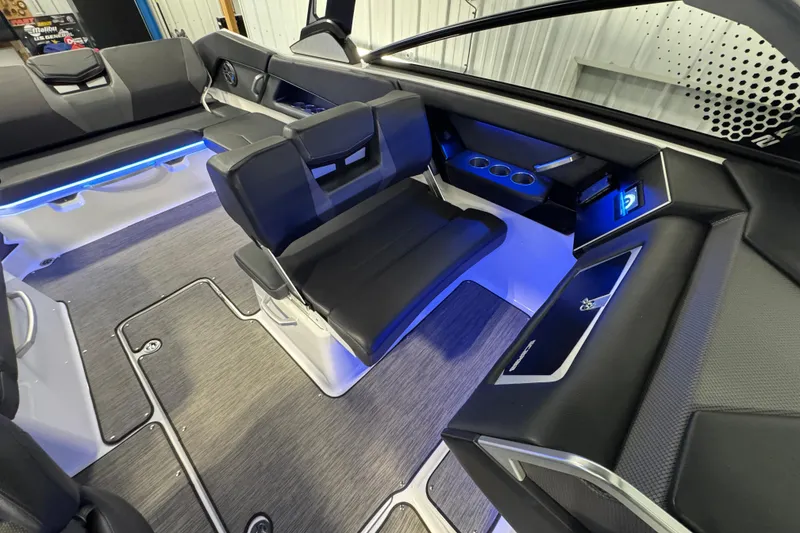 Slide: The Image of Interior of 2021 Scarab 285 ID boat with modern seating and blue LED lighting. - 26