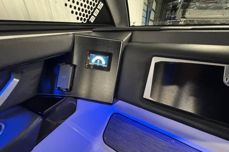 Slide: The Image of Interior of 2021 Scarab 285 ID boat with digital display and sleek design. - 27