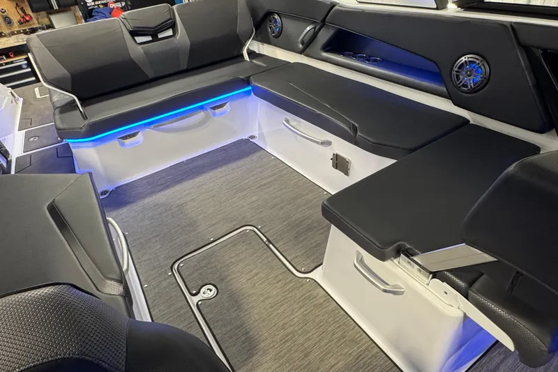 Slide: The Image of Interior of 2021 Scarab 285 ID boat with sleek seating and ambient lighting. - 30