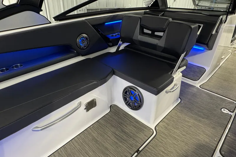 Slide: The Image of Interior of 2021 Scarab 285 ID boat with sleek seating and blue LED lighting. - 31