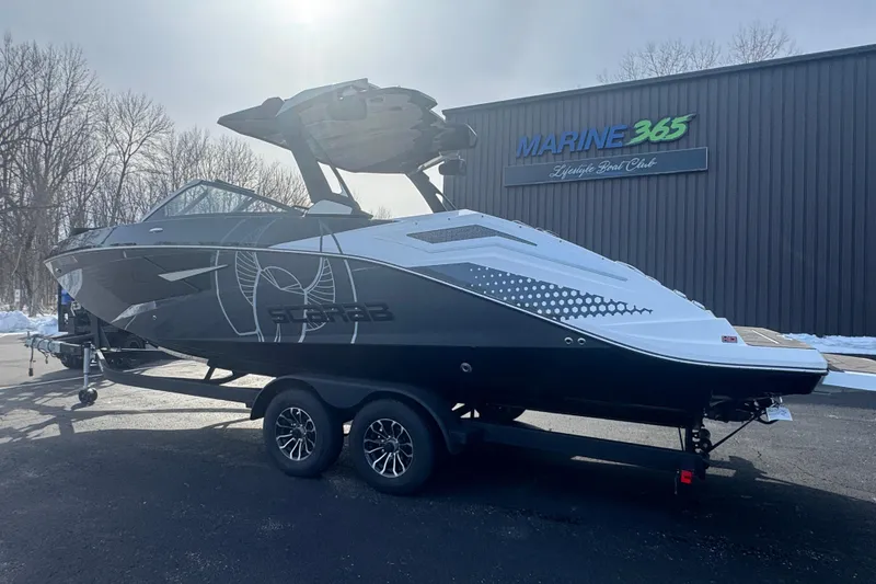 Slide: The Image of 2021 Scarab 285 ID boat on trailer at Marine 365, snowy background. - 7