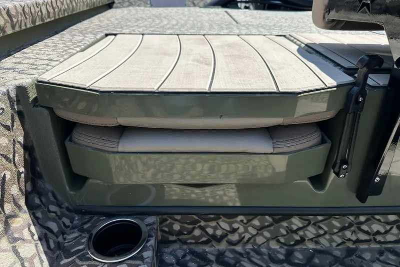 Slide: The Image of 2026 Vexus ACX 2000 boat seat with camouflage pattern and storage compartment. - 13