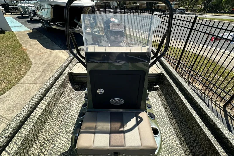 Slide: The Image of 2026 Vexus ACX 2000 boat interior with camouflage design and central console. - 16