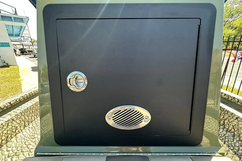 Slide: The Image of 2026 Vexus ACX 2000 boat compartment with secure latch and vent. - 18