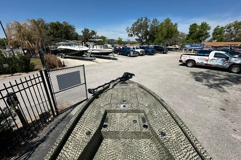 Slide: The Image of 2026 Vexus ACX 2000 boat in parking lot with trucks and trailers nearby. - 20