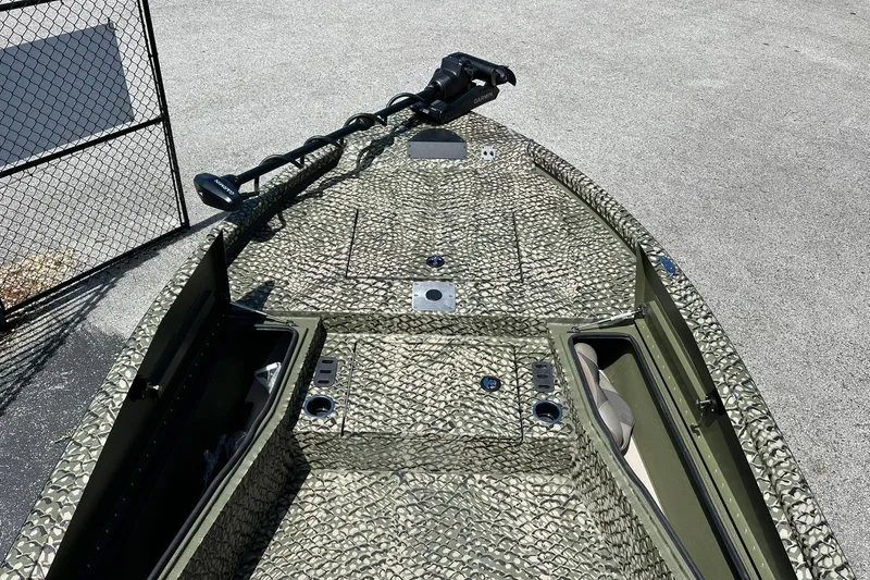 Slide: The Image of 2026 Vexus ACX 2000 boat with camouflage pattern and advanced trolling motor. - 23