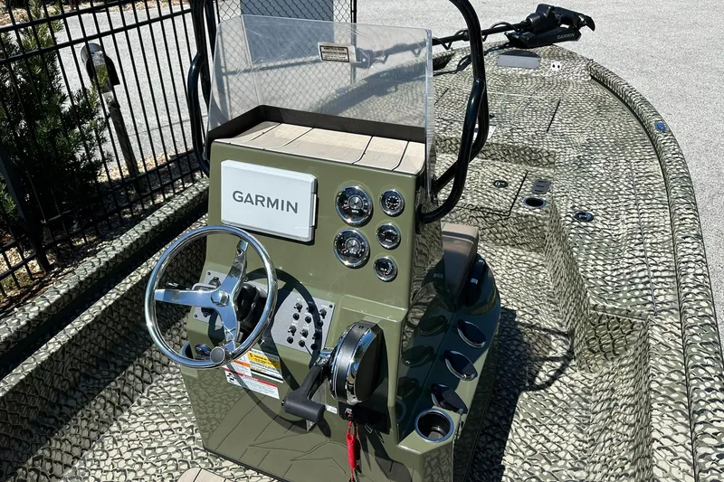 Slide: The Image of 2026 Vexus ACX 2000 boat dashboard with Garmin navigation system and steering wheel. - 6