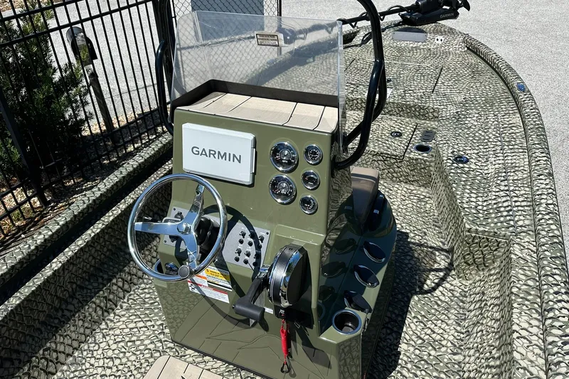 Slide: The Image of 2026 Vexus ACX 2000 boat console with Garmin navigation system and camouflage design. - 7