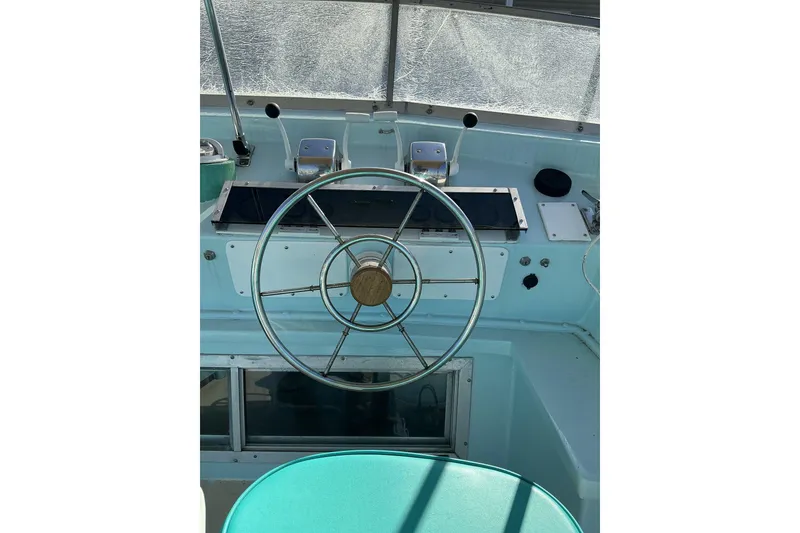 Slide: The Image of 1972 Whitcraft Hatteras boat helm with vintage steering wheel and controls. - 19
