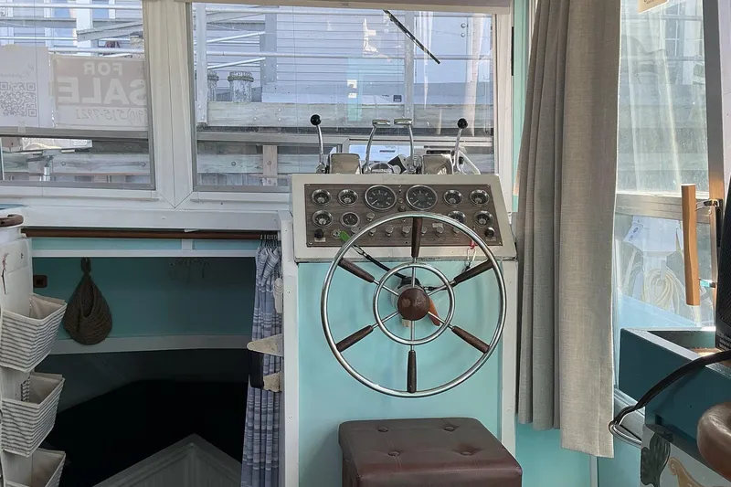 Slide: The Image of 1972 Whitcraft Hatteras boat helm with vintage steering wheel and control panel. - 21