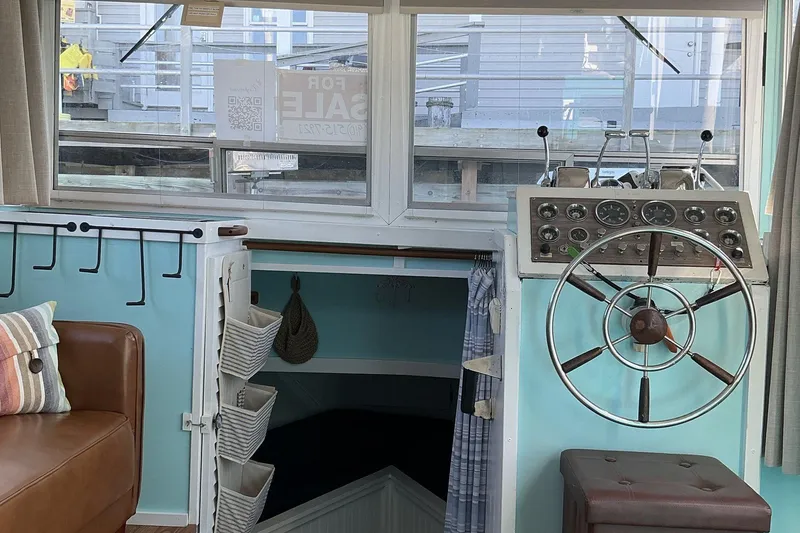 Slide: The Image of 1972 Whitcraft Hatteras boat interior with steering wheel and control panel. - 23