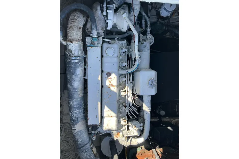 Slide: The Image of 1972 Whitcraft Hatteras engine, showing detailed mechanical components and piping. - 37