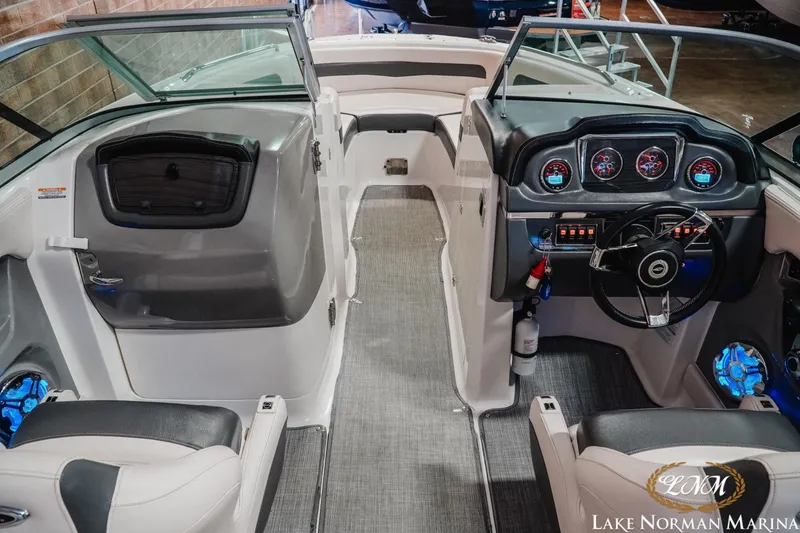 Slide: The Image of 2017 Chaparral 246 SSi boat interior with modern dashboard and seating at Lake Norman Marina. - 11