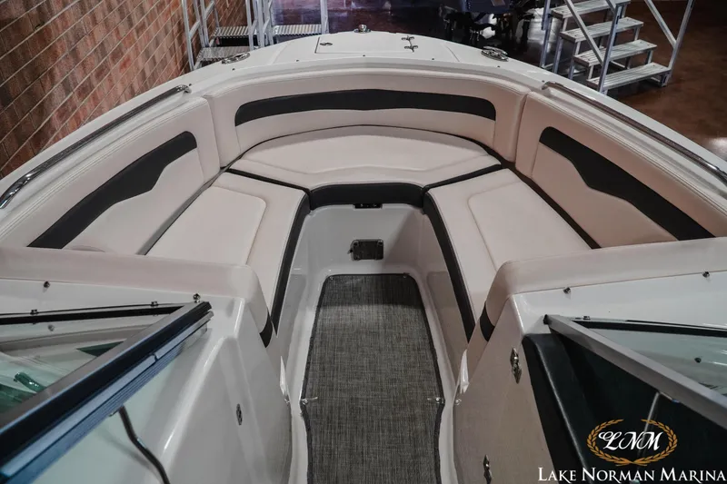 Slide: The Image of 2017 Chaparral 246 SSi boat interior with cushioned seating at Lake Norman Marina. - 12
