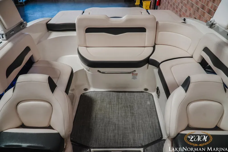 Slide: The Image of 2017 Chaparral 246 SSi boat interior with white and black seating at Lake Norman Marina. - 15