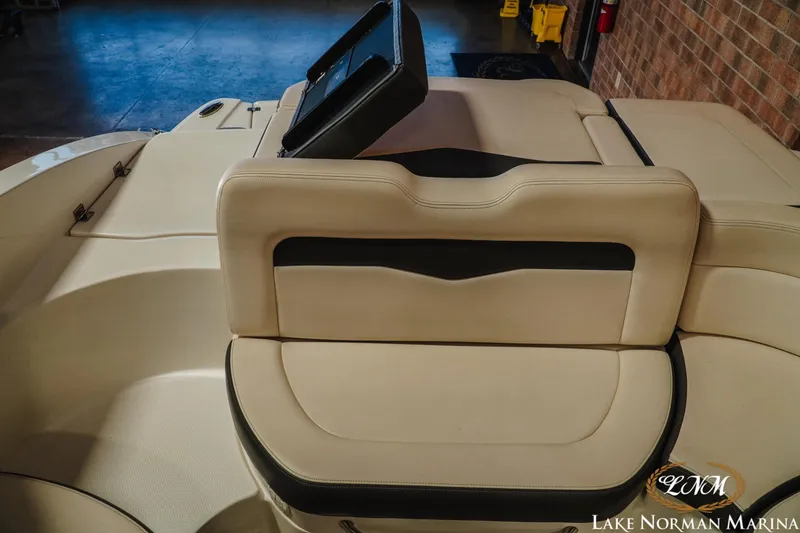 Slide: The Image of 2017 Chaparral 246 SSi boat interior with beige seating at Lake Norman Marina. - 17