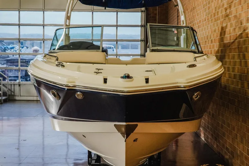 Slide: The Image of 2017 Chaparral 246 SSi boat displayed indoors, showcasing sleek design and modern features. - 4