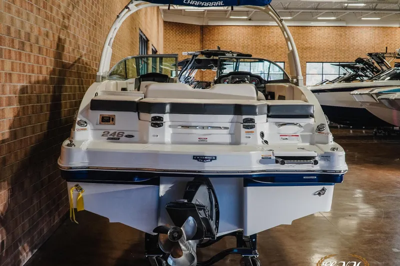 Slide: The Image of 2017 Chaparral 246 SSi boat displayed indoors, showcasing rear view and sleek design. - 6
