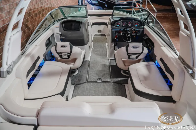 Slide: The Image of 2017 Chaparral 246 SSi boat interior with modern seating and dashboard design. - 7
