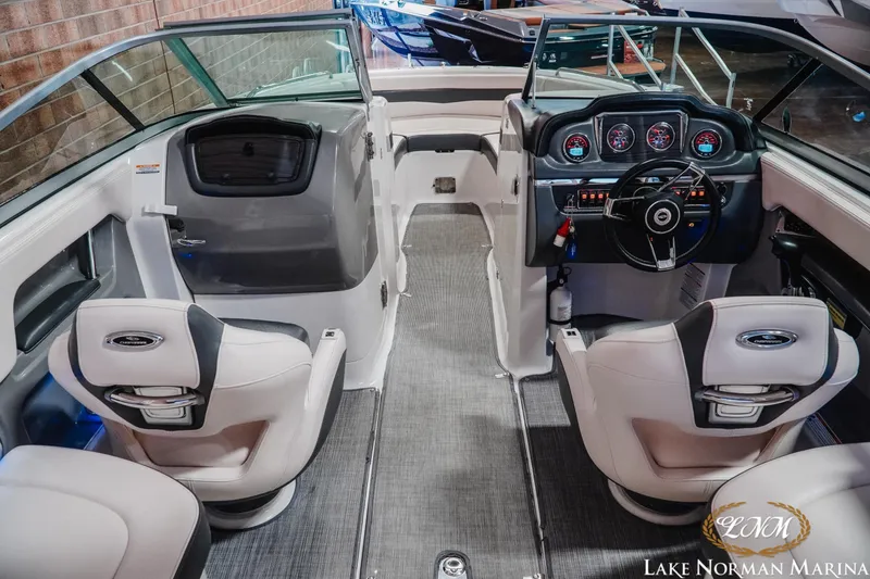 Slide: The Image of Interior view of 2017 Chaparral 246 SSi boat with modern dashboard and seating. - 8