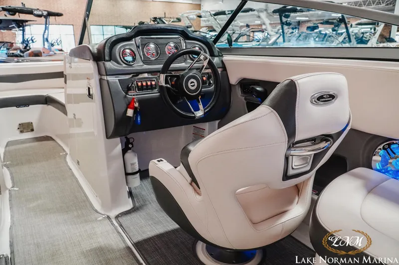 Slide: The Image of 2017 Chaparral 246 SSi boat interior with steering wheel and captain's chair at Lake Norman Marina. - 9