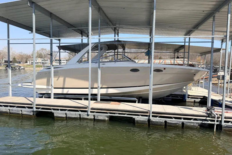 The Image of 2005 Regal 3350 Sport Cruiser docked under covered marina. - 4