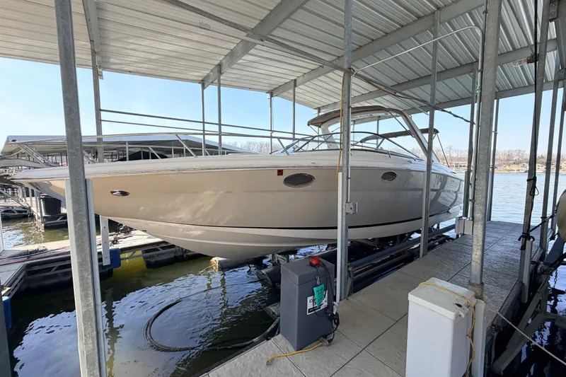 Slide: The Image of 2005 Regal 3350 Sport Cruiser docked in a covered marina slip. - 7