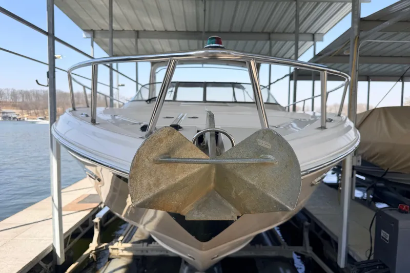 Slide: The Image of 2005 Regal 3350 Sport Cruiser docked under a covered marina. - 8