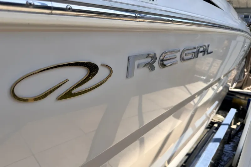 Slide: The Image of Side view of a 2005 Regal 3350 Sport Cruiser boat with logo. - 9