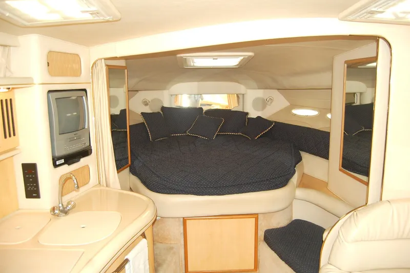 Slide: The Image of Interior of 2000 Sea Ray 340 Sundancer yacht with cozy bed and compact amenities. - 20
