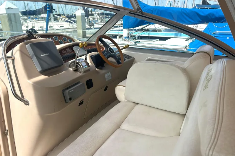 Slide: The Image of Interior of a 2000 Sea Ray 340 Sundancer boat with helm and seating area. - 27