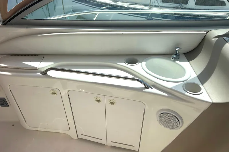 Slide: The Image of Interior view of a 2000 Sea Ray 340 Sundancer boat with sink and storage cabinets. - 29