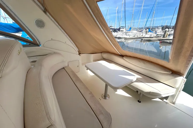 Slide: The Image of Interior view of 2000 Sea Ray 340 Sundancer yacht with seating and table. - 31