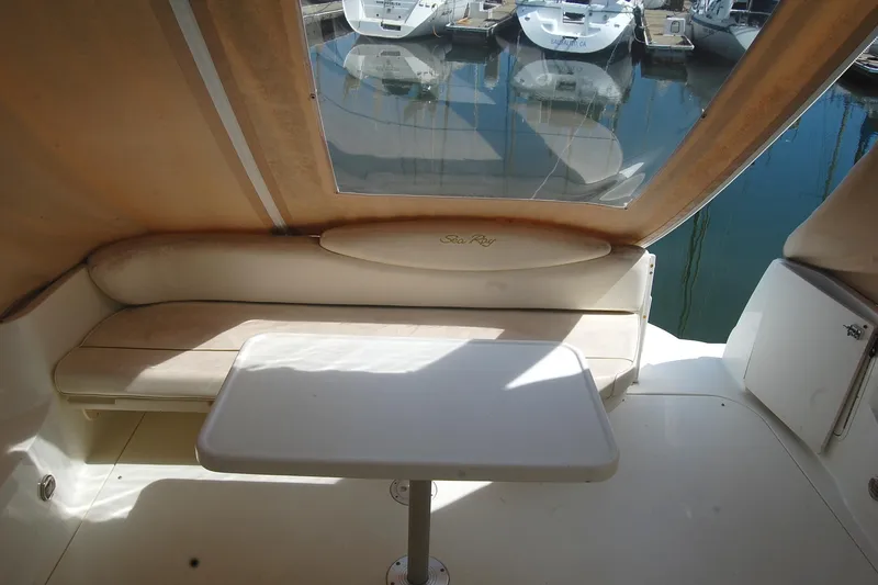 Slide: The Image of Interior view of a 2000 Sea Ray 340 Sundancer yacht with seating and table. - 34