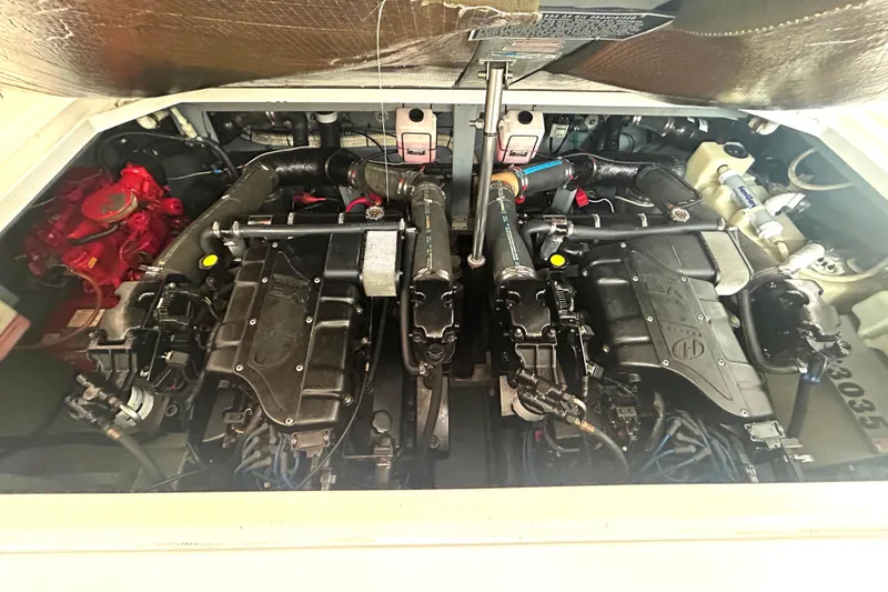 Slide: The Image of Engine compartment of a 2000 Sea Ray 340 Sundancer boat, showcasing dual engines. - 36