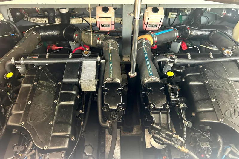 Slide: The Image of Engine compartment of a 2000 Sea Ray 340 Sundancer boat, showcasing dual engines. - 37