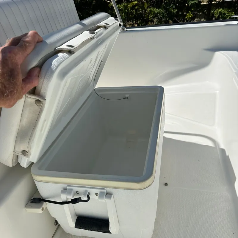 Slide: The Image of Open cooler on 2014 Boston Whaler 150 Montauk boat deck. - 9